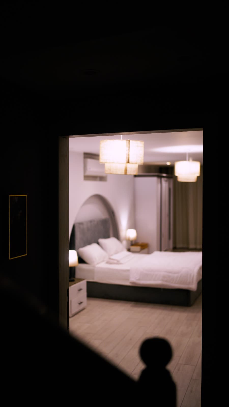 The Arch Suite — arched headboard and woven pendant lamps