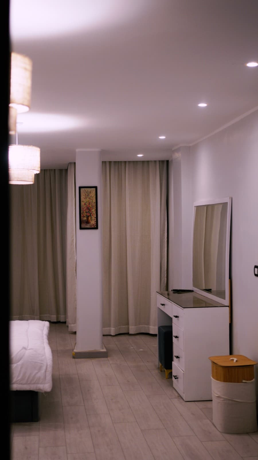 Room hallway with tall mirror and terrazzo floor